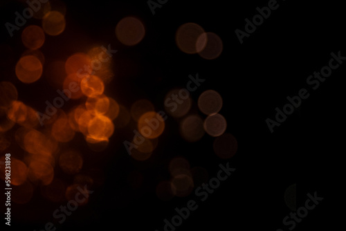 Abstract background with gold sparkling bokeh, disco, festive backdrop for design.