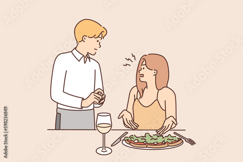 Restaurant visitor woman complains about quality of food and taste of served dish to waiter Generative AI