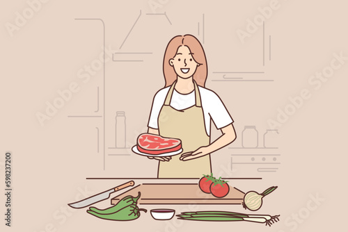 Woman cook holding raw meat steak standing near kitchen table with cutting board and vegetables Generative AI