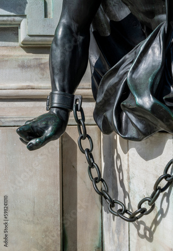 Detailfoto der angeketteten Krieger am Sockel der Reiterstatue Friedrich Wilhelm von Brandenburg, Schloss Charlottenburg, Berlin, Deutschland photo