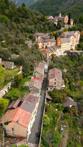 Vertical aerial view. view from the top of the hill to village on sunset 