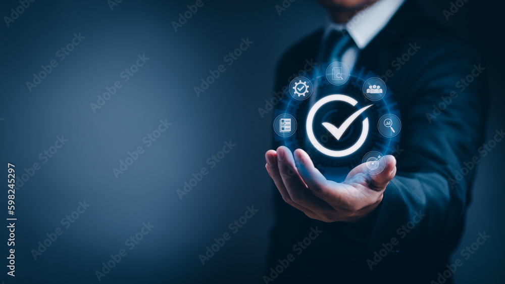 Businessman hand showing good quality assurance(QA) with icon , certification concept standards and quality control(QA) Confidence in a product or service Customer Satisfaction Guarantee Businessman hand showing good quality assurance(QA) with icon , certification concept standards and quality control(QA) Confidence in a product or service Customer Satisfaction Guarantee