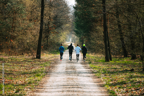 Morning Running Motivation  Running through Nature  Professional Runners Train in a Lush Pine Forest