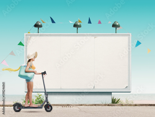 Tourist going to the beach and large billboard