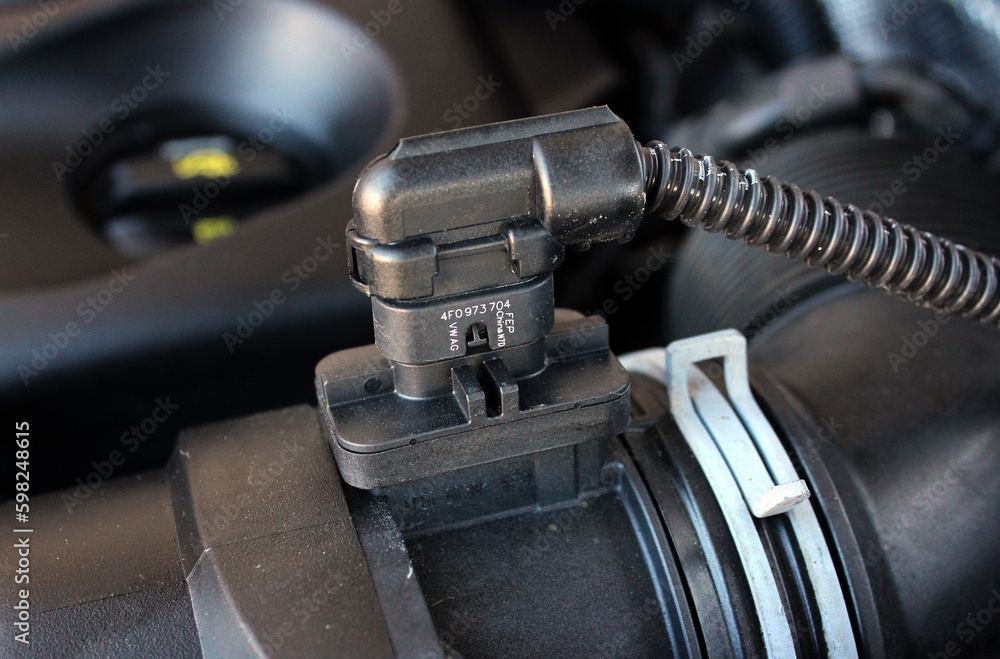 Mass flow sensor. Air flow sensor. Car engine parts. Under the hood of