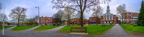 Historic Lebanon City Hall building, downtown skyline, and Colburn Park in Grafton County, western New Hampshire, panoramic spring landscape in rain © Naya Na