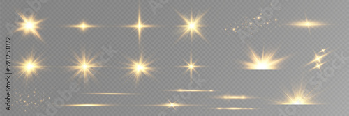 Golden particles of light. Golden light. Light flare.Stars isolated on transparent background.