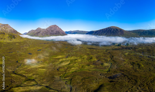 Panoramic aerial view of banks of fog in the valley of Glen Coe in the highlands of Scotland