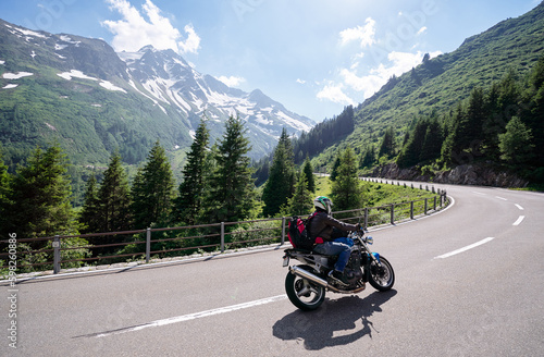 Moto trip. Lifestyle and travel. Beautiful landscape. A road through the Swiss Alps, Switzerland.