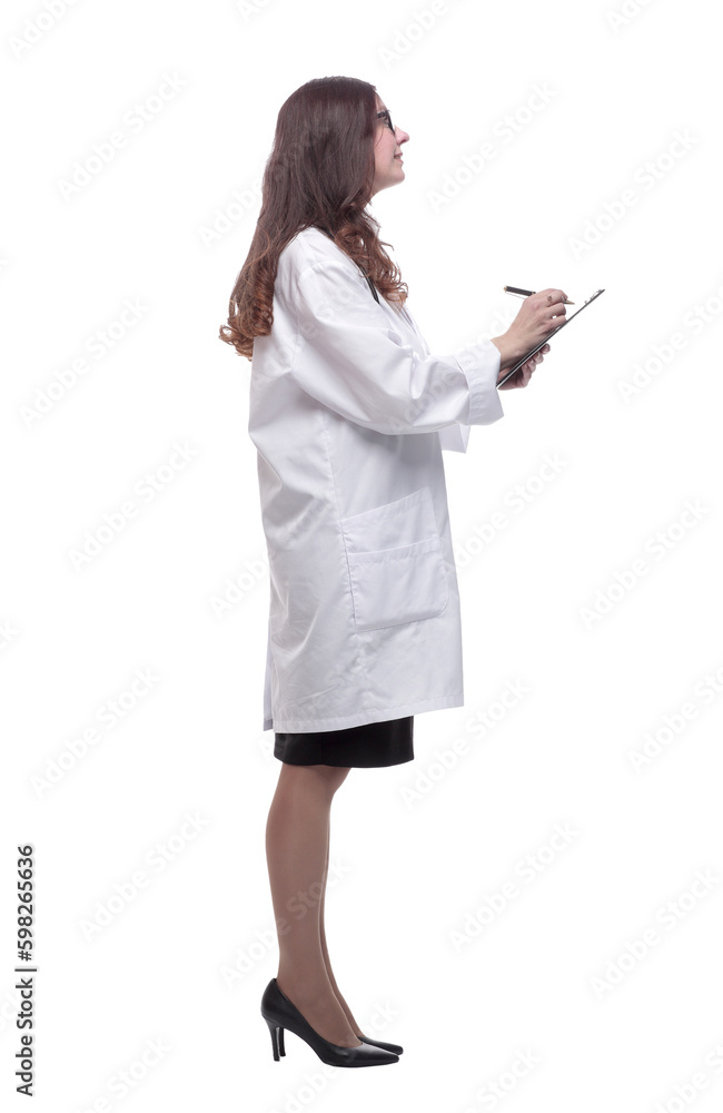 in full growth. young doctor making notes in the clipboard in full growth. young doctor making notes in the clipboard