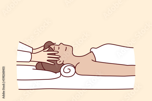 Woman in massage parlor lies on couch near hands of spa specialist doing facial rejuvenation procedure. Massage of head for getting rid of migraine and rejuvenating effect in cosmetology Generative AI
