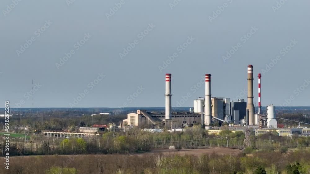 drone rotate around coal power plant in Konin Poland , old power station replaced with nuclear energy production drone rotate around coal power plant in Konin Poland , old power station replaced with nuclear energy production