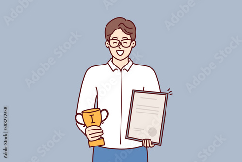 Businessman holds certificate and cup winner of competition among sellers company who exceeded sales plan. Businessman boasts letter of thanks received from partners corporation or Generative AI
