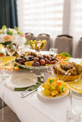 Banquet table with food and snacks at a wedding, birthday or party