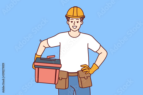 Male foreman holds case of working tools for furniture repair or plumbing work and looks at screen with smile. Guy in helmet of builder works as foreman or builder providing professional Generative AI