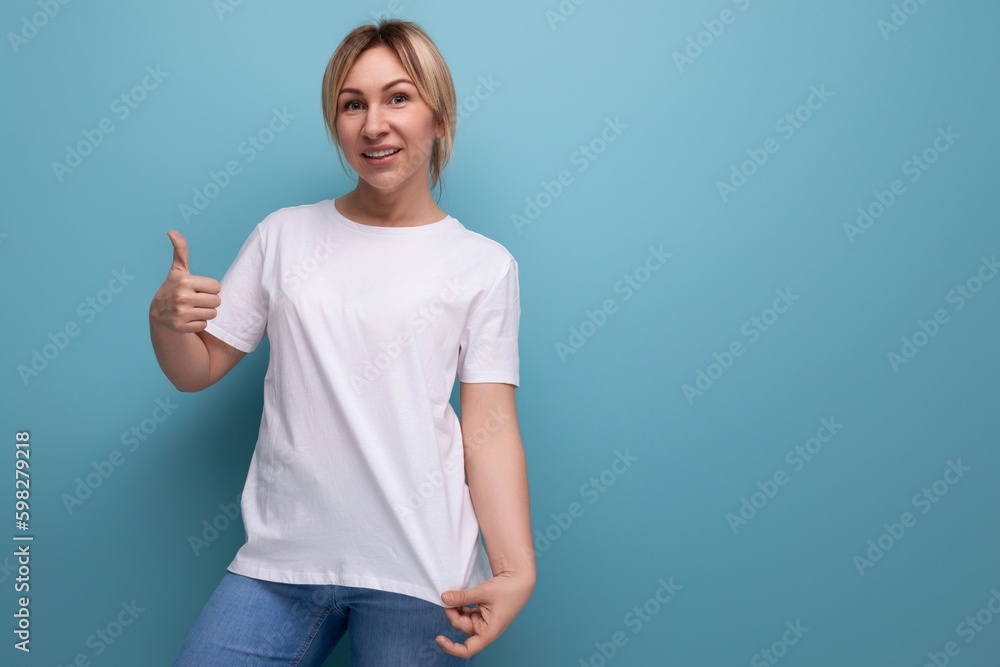 blond young lady in white tank top for business logo print on studio background with copy space blond young lady in white tank top for business logo print on studio background with copy space