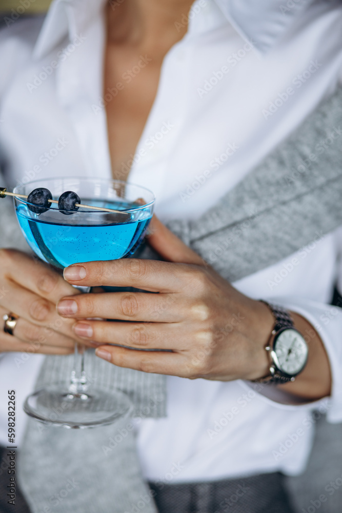 Woman drinking alcohol drink in a restaurant Woman drinking alcohol drink in a restaurant