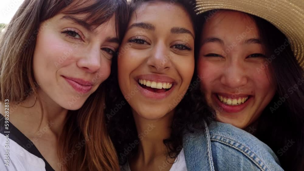 Young group of three diverse women smiling standing together outdoors. Joyful portrait of millennial female friends looking at camera hugging each other showing love and unity. Generative AI Young group of three diverse women smiling standing together outdoors. Joyful portrait of millennial female friends looking at camera hugging each other showing love and unity. Generative AI