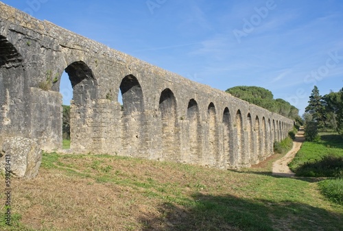 Wonderful landscapes in Portugal. Beautiful scenery of Aqueduct of the Convent of Christ in Tomar. It is 6 kilometres long with a total of 180 arches. Sunny spring day. Selective focus
