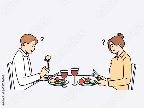 Confused couple sit at table in restaurant eating bad meal at dinner. Distressed man and woman dissatisfied with food in cafe. Vector illustration.  Generative AI