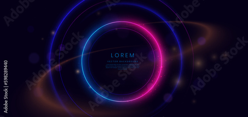 Abstract technology futuristic neon circle glowing blue and pink  light lines with speed motion blur effect on dark blue background.