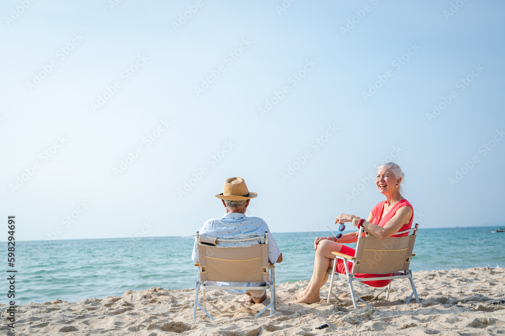 Senior couple relaxing on sea beach,Summer vacation,Travel and vacation on beach.