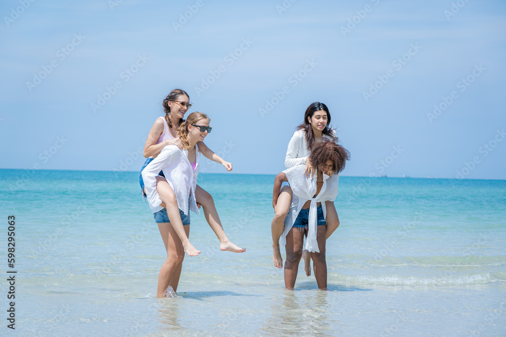 Young woman playing together on tropical beach at summer,Summer vacation concept. Young woman playing together on tropical beach at summer,Summer vacation concept.