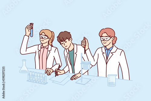 Students conduct experiments in laboratory doing scientific research to prepare for chemistry exam. Guys and girls in white coats stand at laboratory table with flasks filled with Generative AI