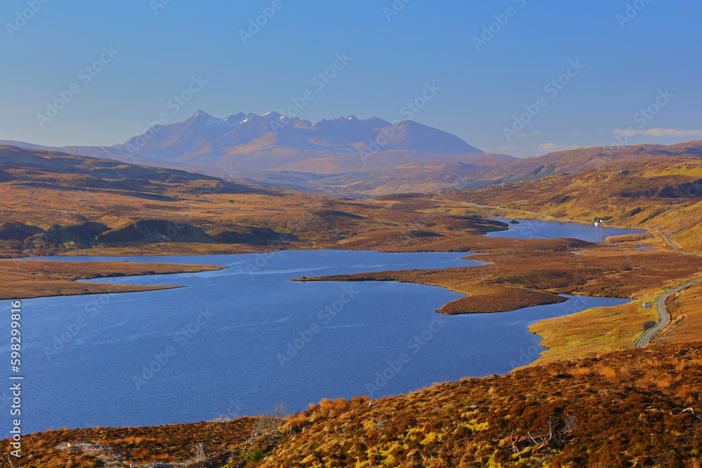 Morning light at Loch Leathan with the black cuilin mountains in the distance, isle of skye, scotland, uk.