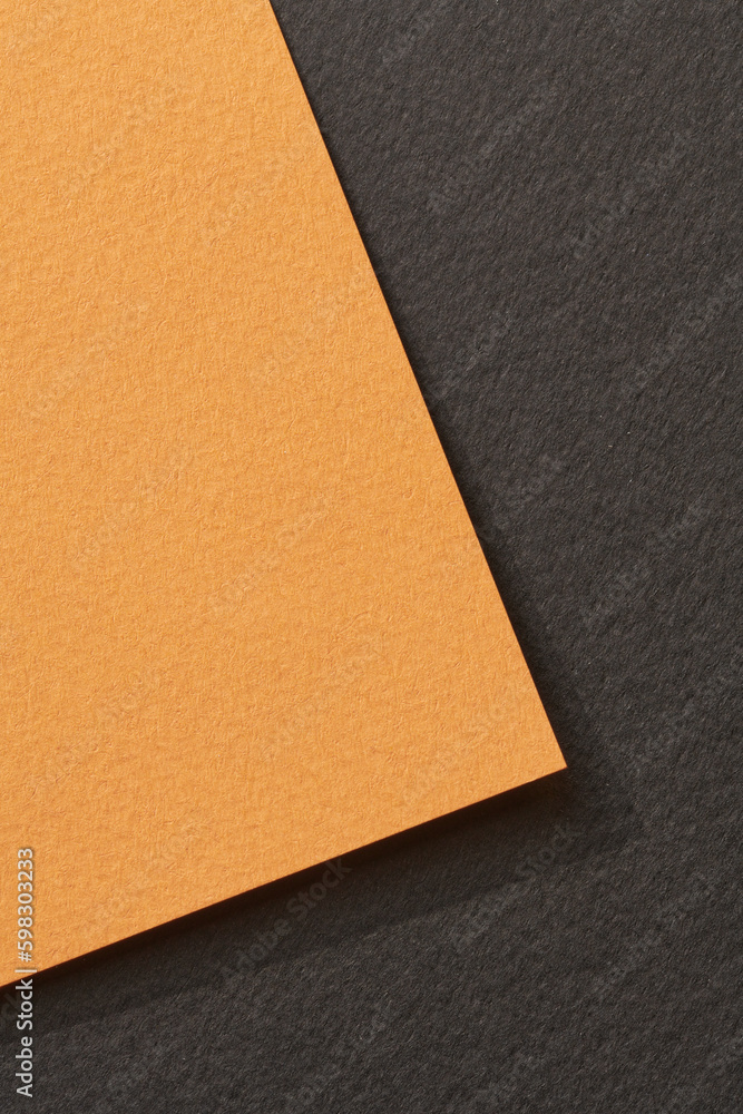 Fototapeta premium Rough kraft paper background, paper texture black orange colors. Mockup with copy space for text