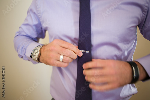 Close up creative image of a Groom's Wedding Attire at a real wedding