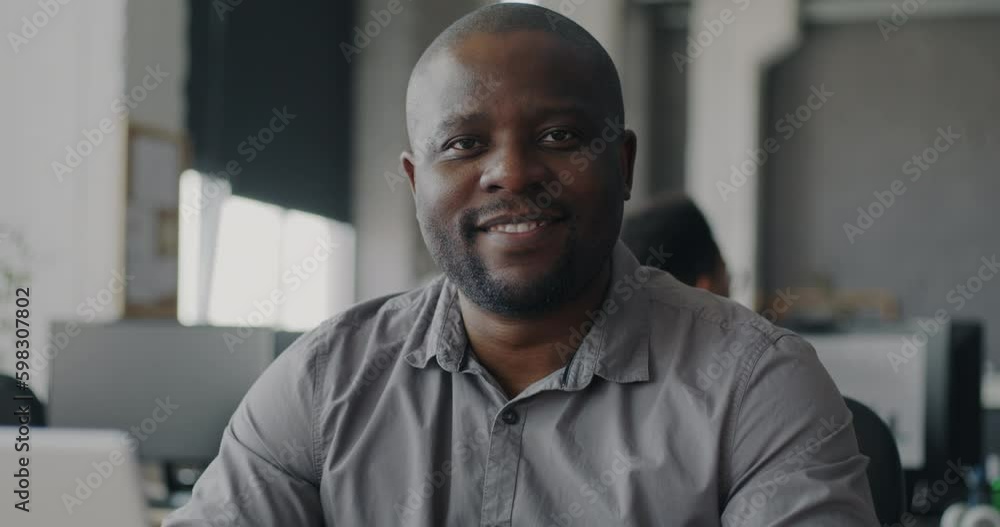 Portrait of African American man manager sitting in modern open space office smiling feeling optimistic and confident. Businessman in coworking space looking at camera. Generative AI Portrait of African American man manager sitting in modern open space office smiling feeling optimistic and confident. Businessman in coworking space looking at camera. Generative AI