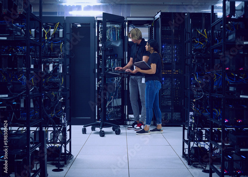 Technicians working in server room