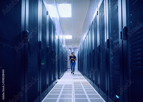 Female technician walking in server room