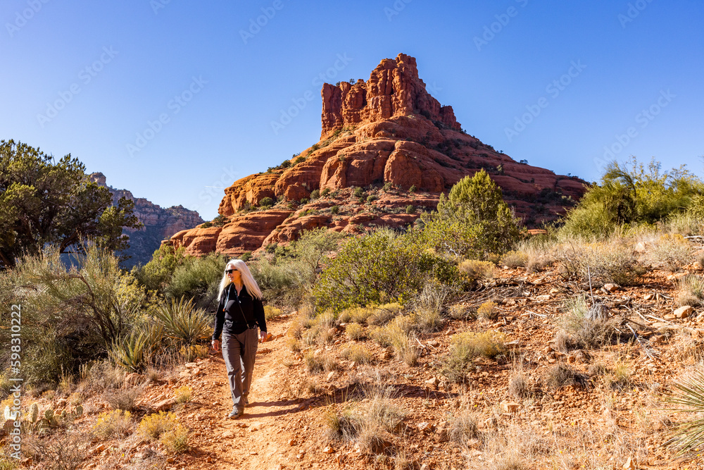 United States, Arizona, Sedona, Senior blonde woman hiking in wilderness United States, Arizona, Sedona, Senior blonde woman hiking in wilderness