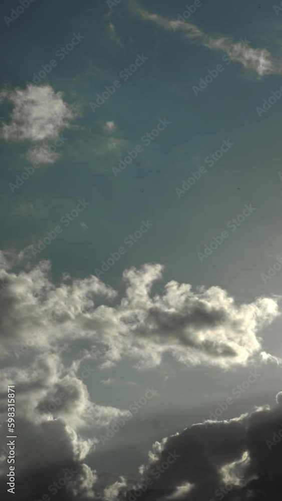 Time-lapse of Puffy White Clouds in Stormy Sky. Natural Timelapse of Moving Clouds in Atmospheric Weather. Timelapse of Dynamic Cloudscape in Dramatic Sky Vertical video Time-lapse of Puffy White Clouds in Stormy Sky. Natural Timelapse of Moving Clouds in Atmospheric Weather. Timelapse of Dynamic Cloudscape in Dramatic Sky Vertical video