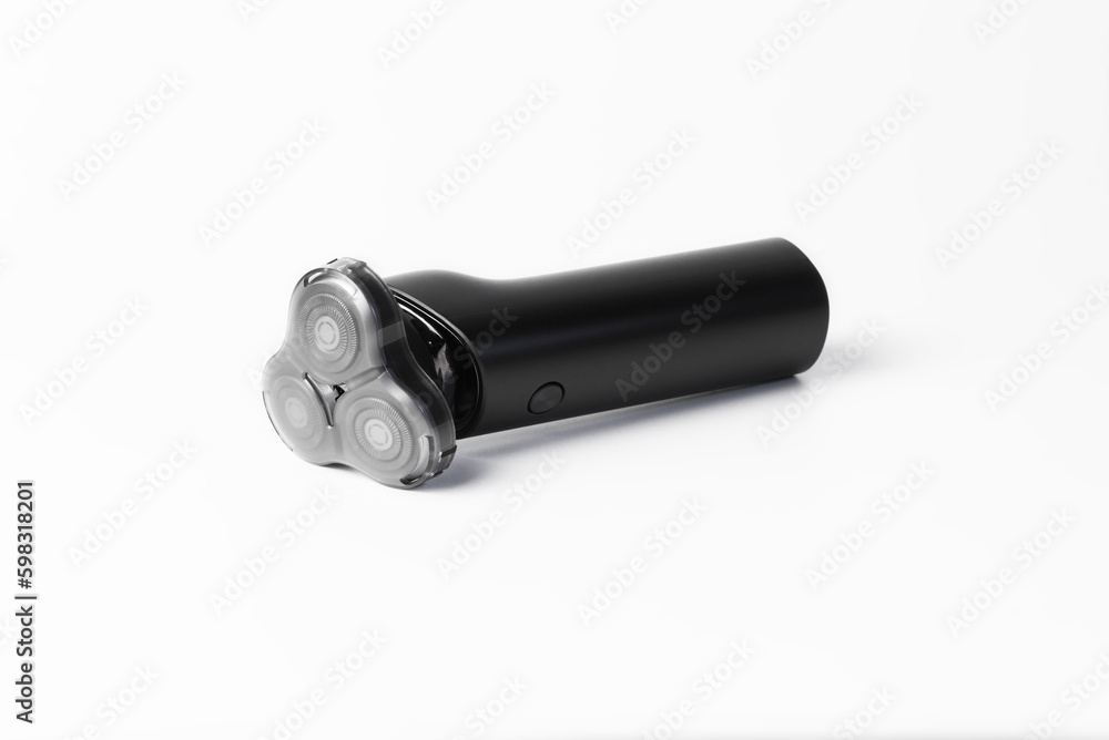 Wireless men's electric shaver in black isolated on a white background Wireless men's electric shaver in black isolated on a white background