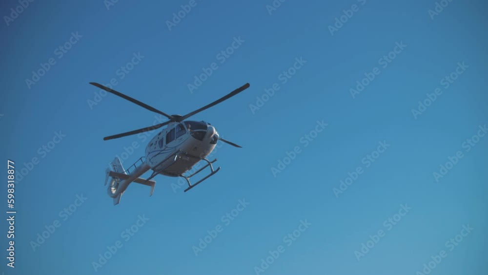 Film crew's helicopter flies over the desert during filming. Movie production Film crew's helicopter flies over the desert during filming. Movie production