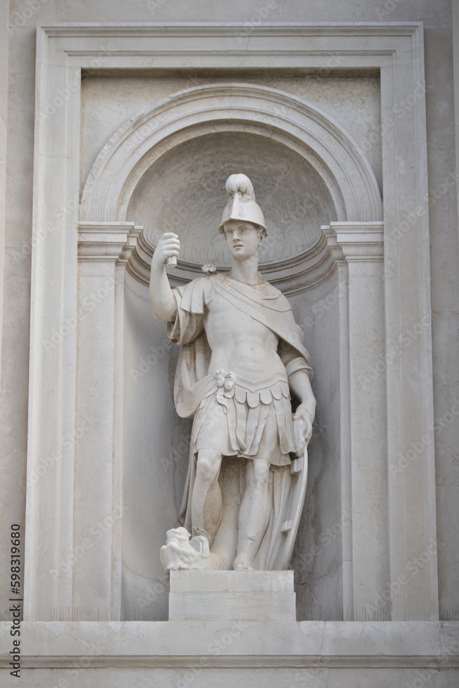 a depiction of a medieval soldier with broken lance and uniform as a sculpture in Venice Italy