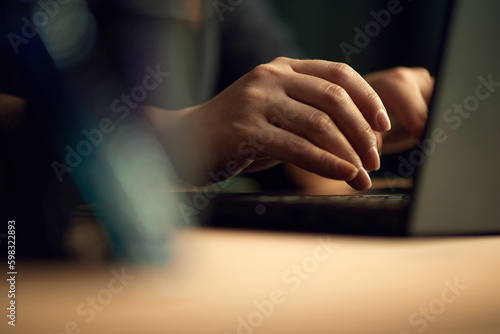 Close-up image of female hands typing on keyboard. Business woman working on laptop, making projects. Concept of business, career development, profession, occupation, technologies