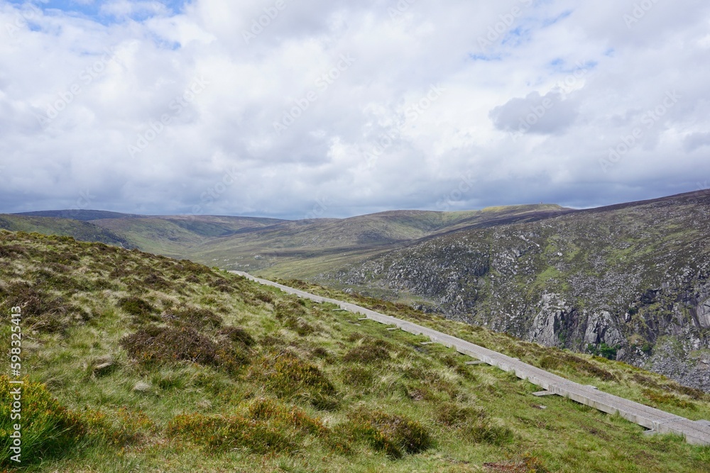 Hking trail in the cloudy landscape of Ireland