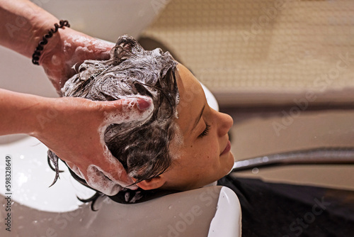 barbershop washing boy's head before haircut