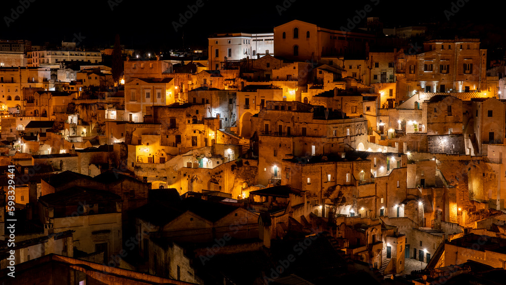 Matera, Italy. Amazing view of the Sassi of Matera at night. Landscape of the historical part of the town. An Unesco World Heritage Site. Touristic destination