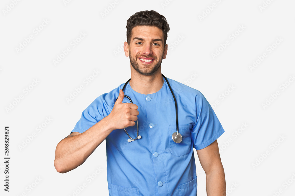 Young nurse man smiling and raising thumb up Young nurse man smiling and raising thumb up