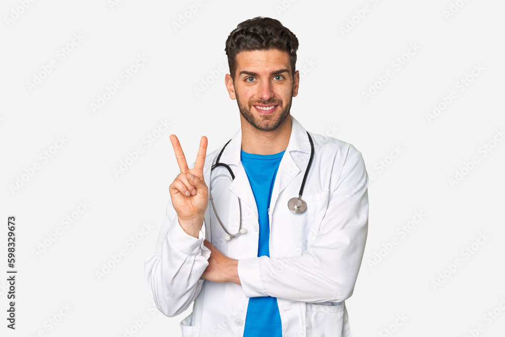 Young doctor man showing number two with fingers. Young doctor man showing number two with fingers.