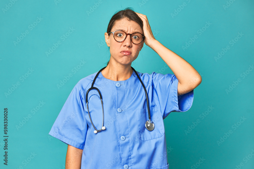A young nurse woman isolated being shocked, she has remembered important meeting. - obrazy, fototapety, plakaty 