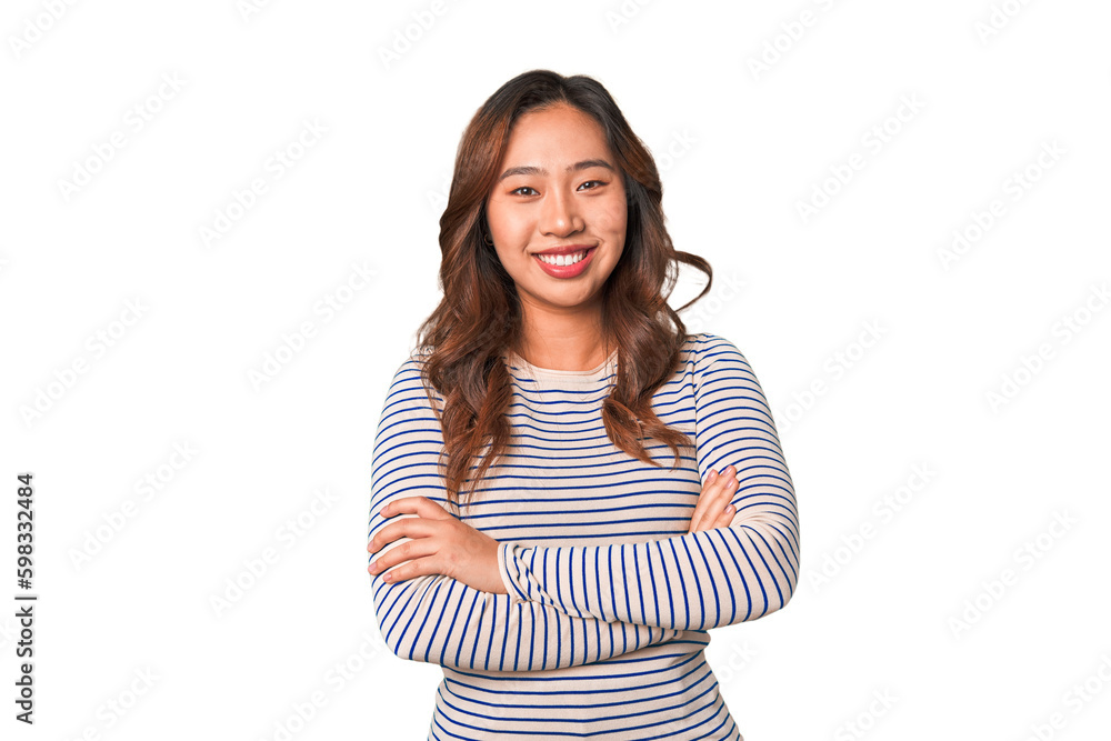 A young chinese woman who feels confident, crossing arms with determination. A young chinese woman who feels confident, crossing arms with determination.