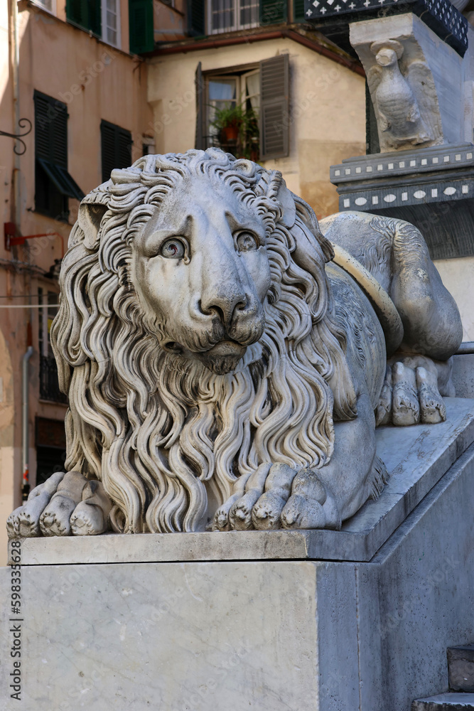 sculpture of a lion at the foot of the Cattedrale di San Lorenzo in Genoa, Italy