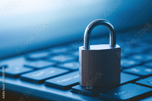 Close-up of a closed padlock on a computer keyboard. Data protection and cyber security concept.