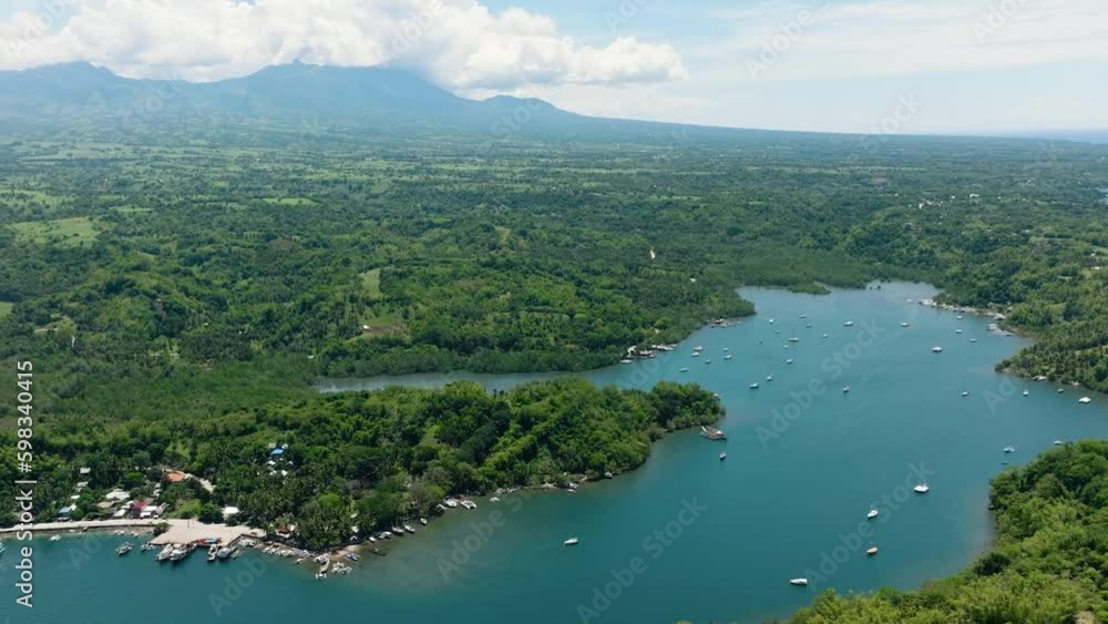 Bay with boats on the background of mountains. Negros, Philippines. Generative AI Bay with boats on the background of mountains. Negros, Philippines. Generative AI
